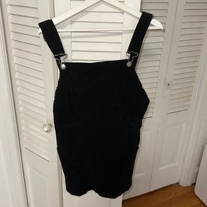 Black, open back, corduroy mini dress. One size fits all.